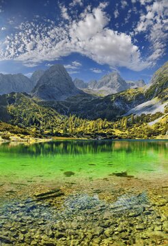 Turquoise Lake Seebensee and the mountain peak of the Tajakopf under a bizarre cloudy sky, Seebensee, Ehrwalder Alm, Ehrwald, Mieminger Gebirge, Tyrol, Austria