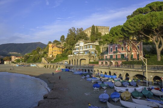 Covered fishing boats and the town beach, Levanto, province of La Spezia, Italy