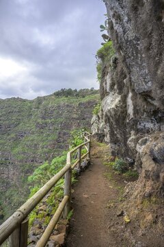 Section of path secured with wooden railing up to Mirador de Abrante, Agulo, La Gomera, Spain