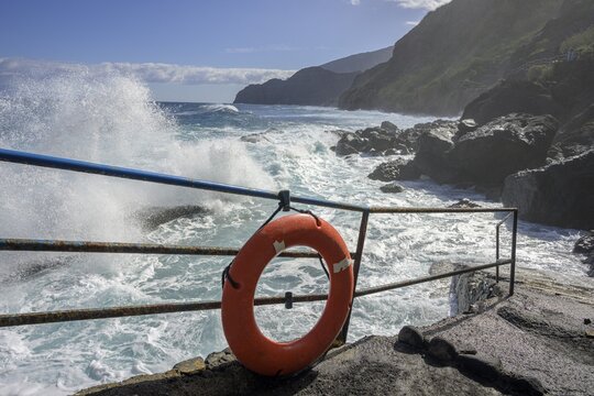 Lifebuoy by the wild coast at Pescante de Agulo, La Gomera, Spain