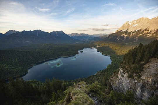 View over the Eibsee lake at sunset, panorama with Zugspitzmassiv in the evening sun, in the back Bishop and Krottenkopf, Wetterstein Mountains, near Grainau, Upper Bavaria, Bavaria, Germany