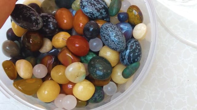 colorful various uncut and raw mineral stones, gemstone and healing stone collection, Healing reiki chakra crystals over fabric background. Gemstones for wellbeing, harmony, meditation, relaxation