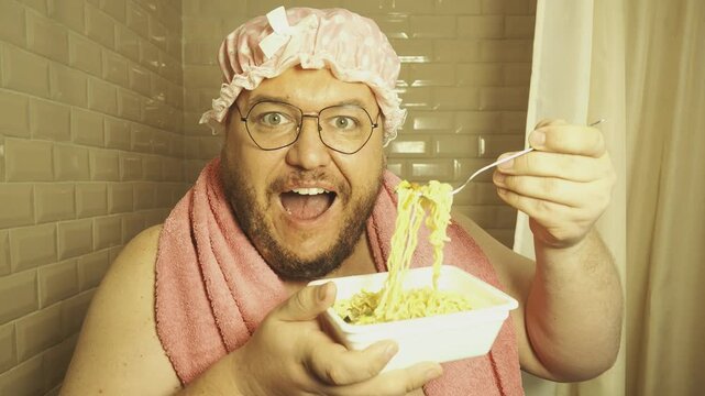 A funny fat man overeats tasty and unhealthy food. Happy guy 