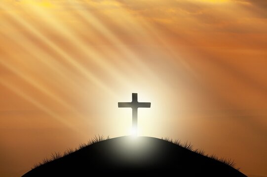 Holy concept: Silhouette wooden cross on  mountain sunset background