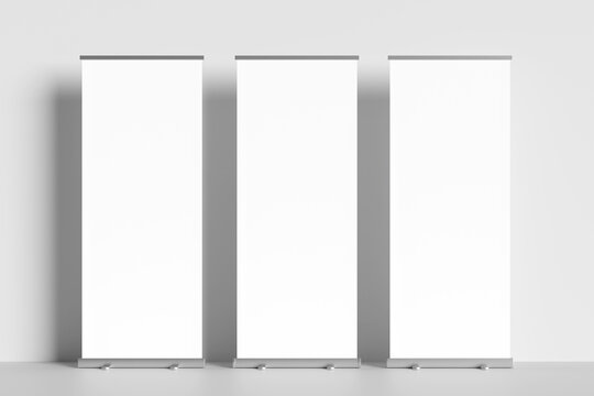 Blank mockup of a roll-up banner display for marketing and conferences. White roll-up display with gray background.