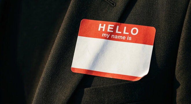 Blank Hello My Name Is Sticker Badge on a Suit Jacket