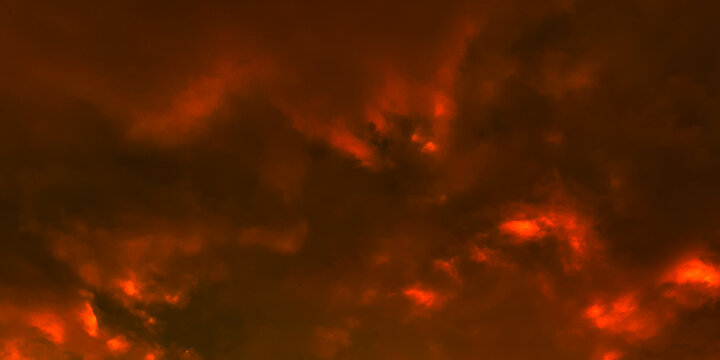 Abstract fiery orange and dark clouds background with dramatic hellfire effect