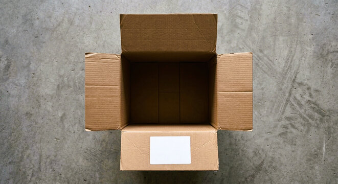 Empty Open Brown Cardboard Box With Blank White Shipping Label