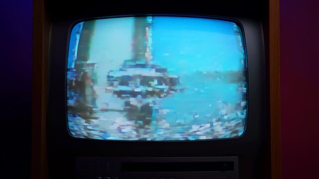 Distorted retro television screen displaying glitchy static and pixelation. Represents nostalgia for vintage media and the evolution of technology