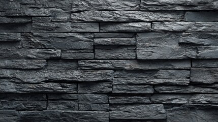 Fototapeta premium Textured dark grey stone wall background with rough surface