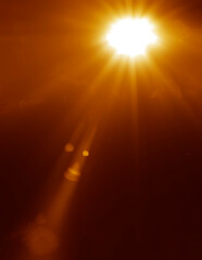 Naklejka premium abstract light burst glitter bokeh image blurred yellow golden bokeh pattern background lens flare halo on black backdrop Sunrays sun rays beam burst sunbeam sun shining gold sky overlay Blurred blur