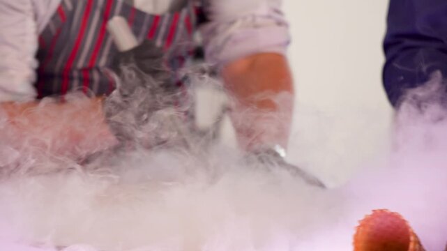 Close-up of artificial smoke moving in the air, atmospheric fog effect, abstract smoke texture, cinematic background with swirling white smoke, studio special effects, slow motion smoke video