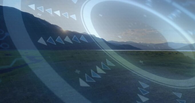 Sun clearing ridge, tech HUD overlay brightening and rotating over grassy plain, aligning chevrons
