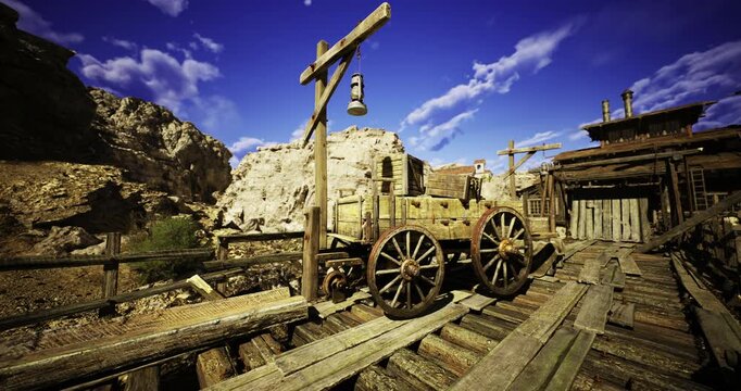 A wooden cart rests on a weathered dock in an old mining area beneath a vibrant blue sky. The rugged landscape features rocky cliffs and wooden structures indicative of a historic site.