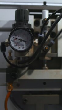 Instrument Displays Pressure Levels On Dial During Machine Warmup For Inspection And Service. Media