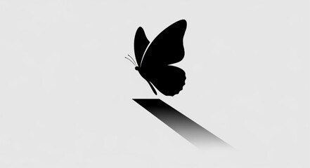 Obraz premium Monochrome Butterfly Silhouette Ascending from a Rectangular Base.