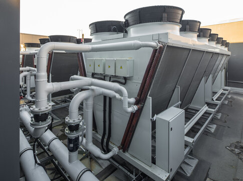 Industrial rooftop HVAC ventilation fans and air conditioning units system.