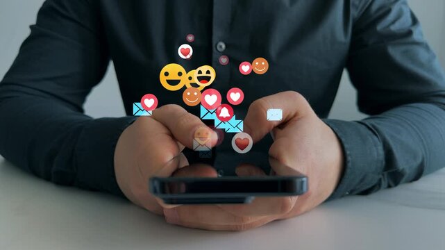 Man using smart phone with emoticon icons of Social Media.Interactive with friends on chat with emoticon feedback.Social media,marketing, like,social network,blog,live,chat reaction and livestream.