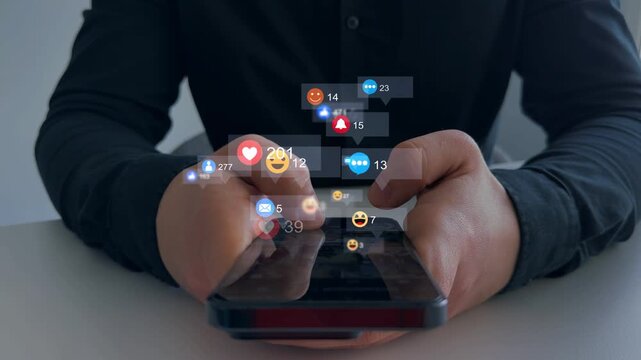 Man using smart phone with emoticon icons of Social Media.Interactive with friends on chat with emoticon feedback.Social media,marketing, like,social network,blog,live,chat reaction and livestream.