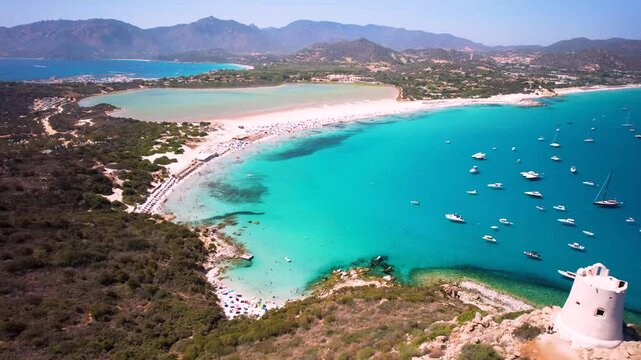 Sardinia Italy 4K Aerial Flight over Villasimius Tower towards Porto Giunco Beach. Cinematic View of Turquoise Bay with Yachts, White Sand and Pink Salt Lake Notteri.