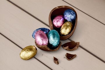 Fototapeta premium Chocolate easter egg on desk backgrouund