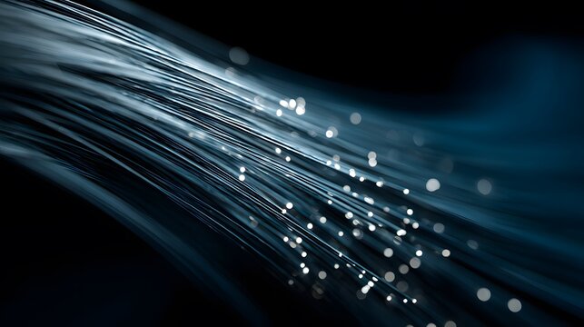 A close-up view of fiber optic cables with sparkling light reflections