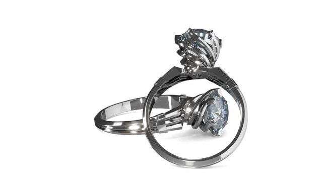 Rotation of white gold rings with round shiny diamond and prong swirl design. 3d animation on white background loop