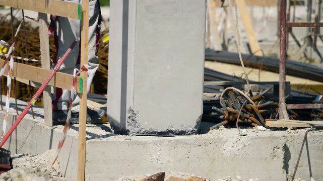First column placement of a concrete column at a construction site outdoor