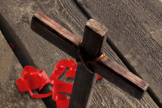 Red heart, Jesus cross on wooden desk