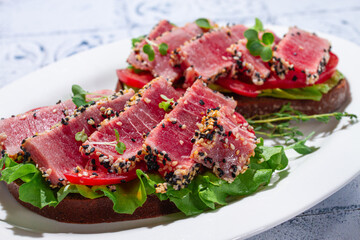 Breakfast, sandwiches, fried tuna fillet, in sesame seeds, no people, top view, homemade, © DideBashvili