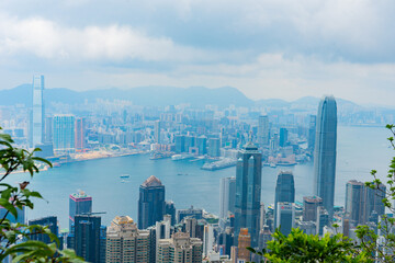 Obraz premium High angle view of Victoria Harbour skyline and skyscrapers at daytime from Victoria Peak, Hong Kong.
