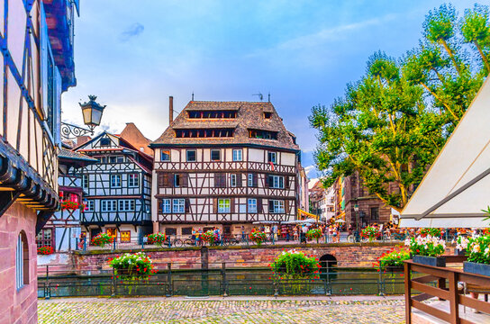 The Petite France Quarter Quartier des Tanneurs, quay embankment promenade of River Ill canal with medieval houses buildings in old town Strasbourg city historic Centre, Alsace region, France
