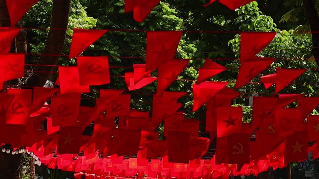 Vietnamese communist flags waving in the wind in Hanoi
