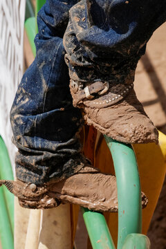 Muddy rodeo rider gear after competition