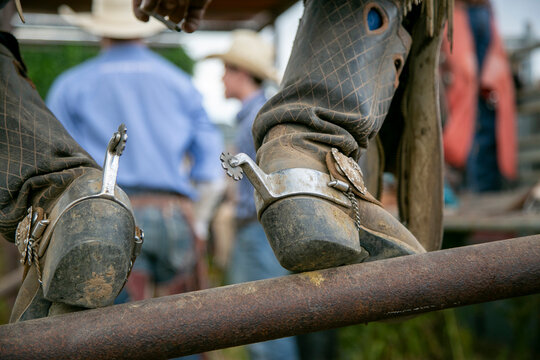 Taos, New Mexico, USA. Small town western rodeo, cowboy boot on fence post detail. 