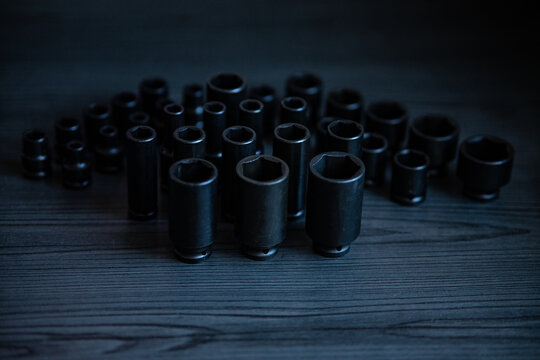 High-performance impact sockets dominate the foreground, showcasing their precision 6-point (hexagonal) broaching and heavy-duty side walls.