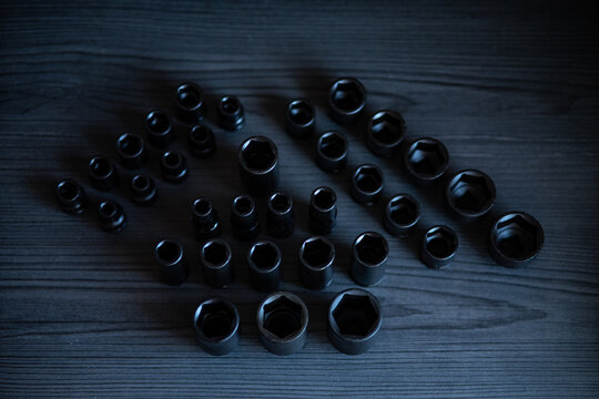 High-performance impact sockets dominate the foreground, showcasing their precision 6-point (hexagonal) broaching and heavy-duty side walls.