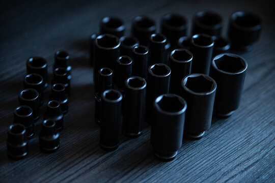 High-performance impact sockets dominate the foreground, showcasing their precision 6-point (hexagonal) broaching and heavy-duty side walls.