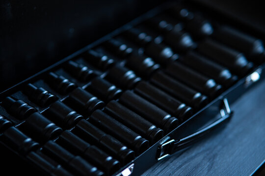 Deep impact socket set in a black metal carrying case, captured in a high-contrast cinematic style.