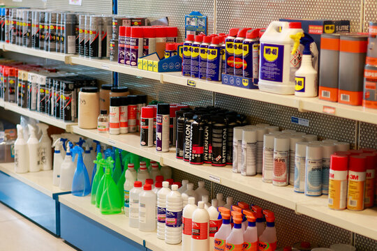 Pamplona, ​​Spain - February 28, 2026. A hardware store or industrial supply shop with various chemicals and aerosols arranged in rows. On the shelves are lubricants, cleaners, spray paints, 