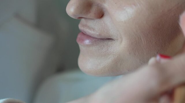 Makeup Application Beauty Routine Woman Applying Blush With Brush Closeup Vertical video.