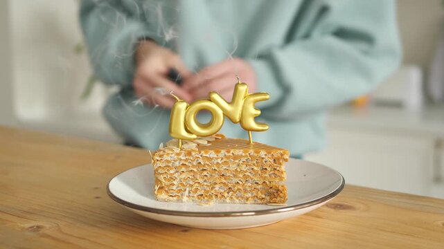 Macro shot of  love honey cake texture with golden candle in focus
