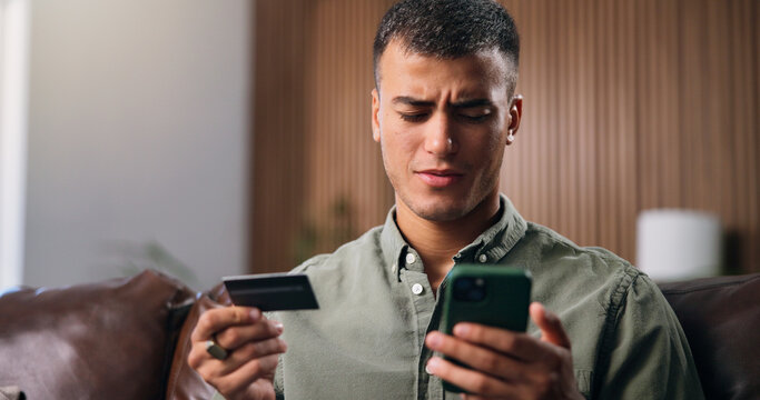 Credit card, confused and man with phone in home with payment error, purchase and online shopping. Ecommerce, doubt and person with bank info on smartphone for glitch, mistake and transaction issue