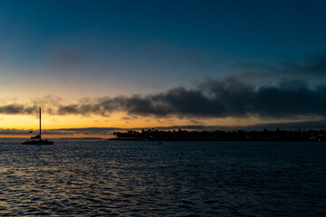 Sails at Twilight: Silhouetted Ships on the Horizon During a Key West Sunset © Rob