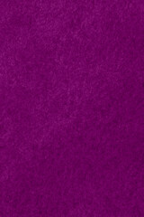 Fototapeta premium close up of textured paper stained wih purple paint