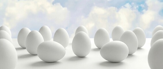 White Easter eggs on white stand, most vertical, two lying horizontally in staggered chessboard pattern
