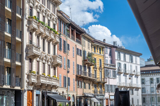 Milan, italy, april 1, 2024. Milan brera district street with colorful historic facades, balconies and shutters under a bright blue summer sky, picturesque cityscape