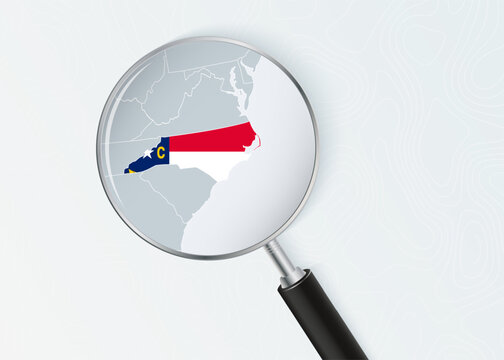 North Carolina Map Under Magnifying Glass with National Flag Overlay.