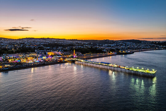 Night view of Paignton Pier and Beach from a drone, Paignton, Devon, England, Europe