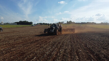 Obraz premium tractors working in the field